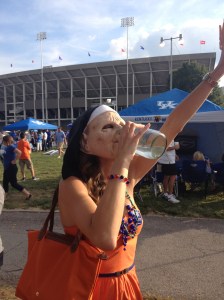 Enjoying Kentucky moonshine in a nun mask