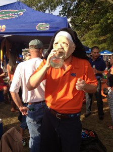Alex enjoying Kentucky moonshine in a nun mask
