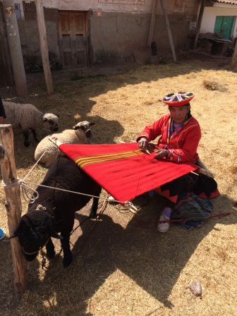 A woman weaving at the market
