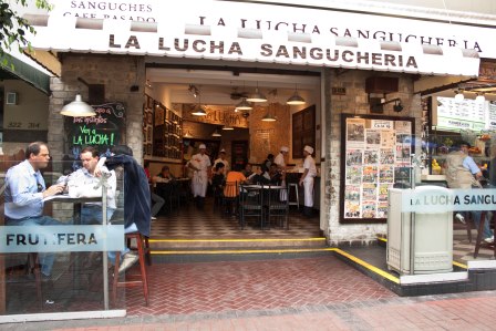 La Lucha Sangucheria. We sat right at the table shown in the left hand corner of this picture! Photo via http://mirafloresparatodos.wordpress.com/