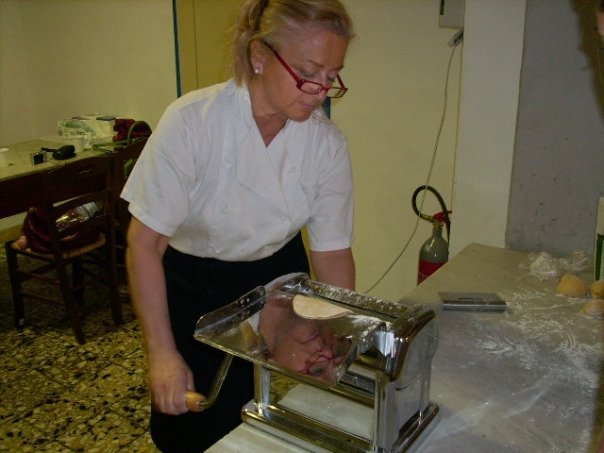 The chef hand-rolling pasta during our cooking class in Tuscany
