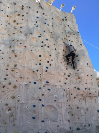 Me conquering the rock climbing wall